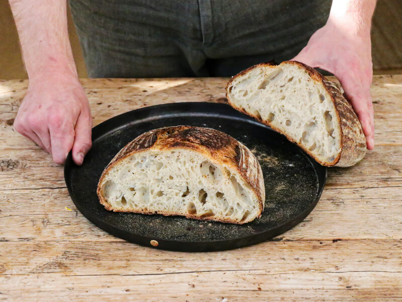 Sourdough cut open on a bench